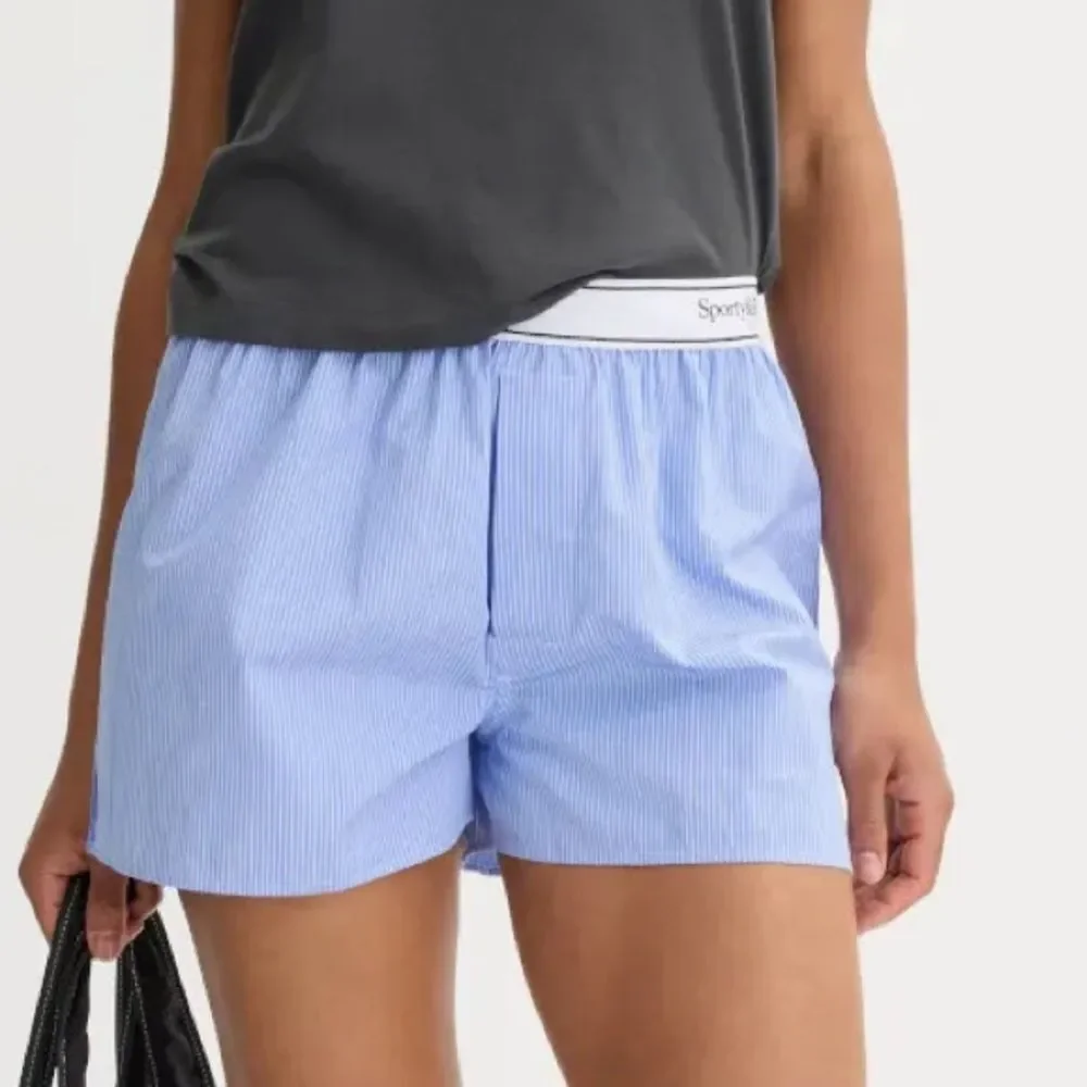 Sporty & Rich Serif Logo Boxer Shorts Light Blue Striped